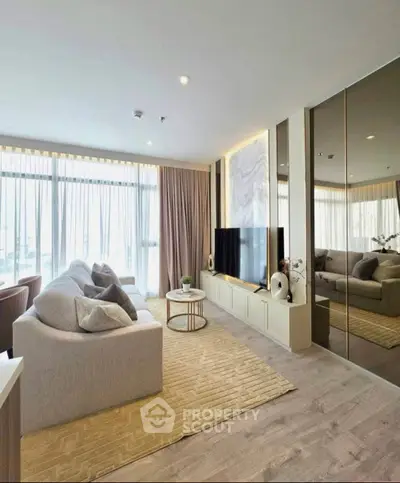 Luxurious living room with modern decor, large windows, and elegant furnishings in a high-end apartment.