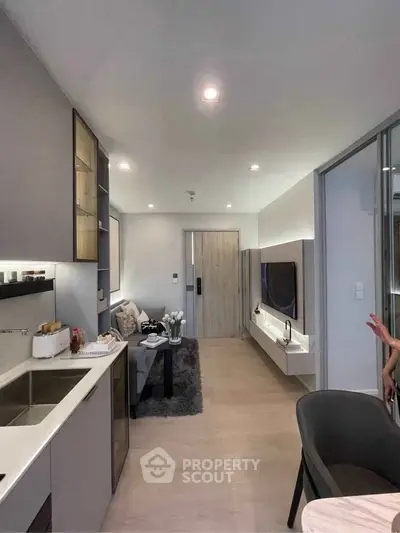 Modern living room with sleek design, open layout, and stylish furnishings in a contemporary apartment.