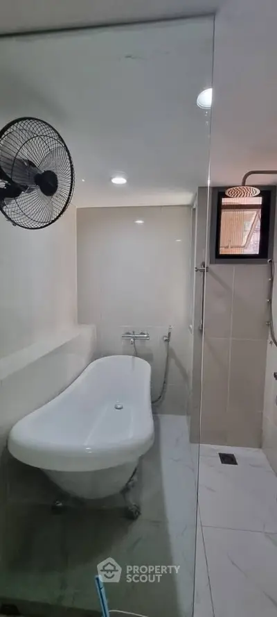 Modern bathroom with elegant freestanding bathtub and sleek tile design