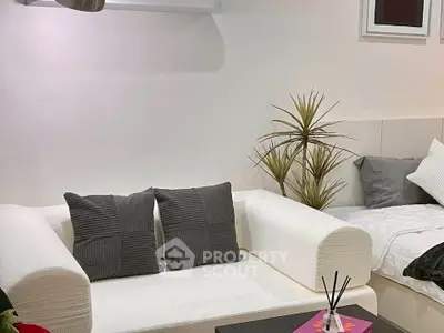 Modern living room with white sofa and stylish decor