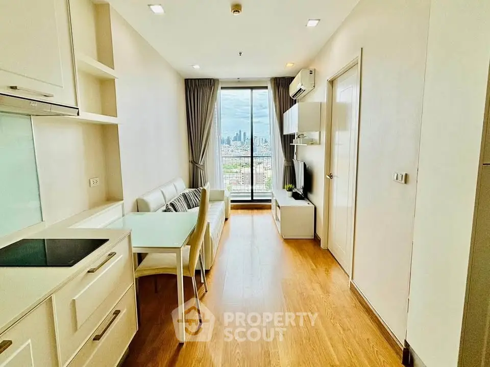 Modern living room with city view, featuring sleek furniture and open layout.