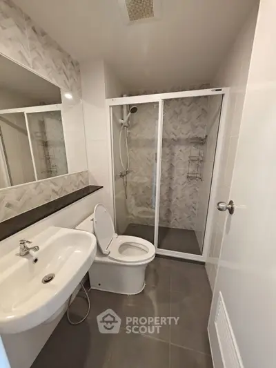Modern bathroom with sleek shower and elegant tile design