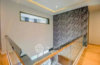 Modern interior with stylish railing and textured wall design