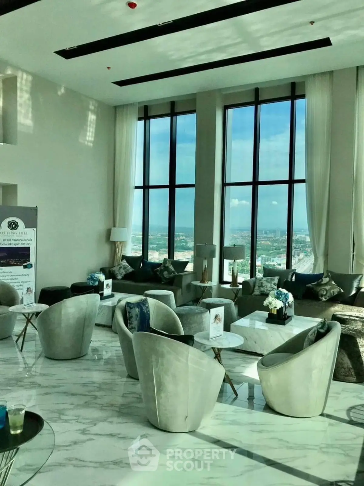 Luxurious high-rise living room with panoramic city views and elegant modern furniture.