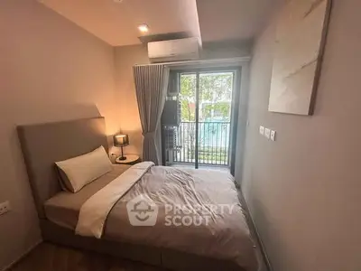Cozy bedroom with balcony view and modern decor