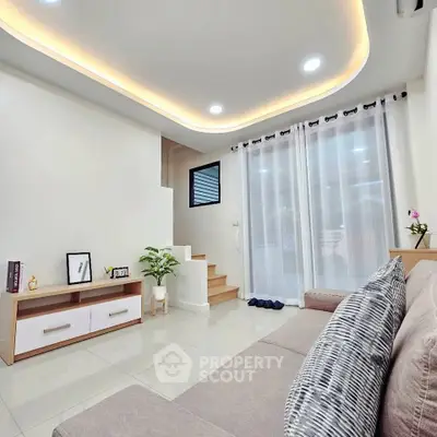 Modern living room with elegant ceiling lights and cozy sofa
