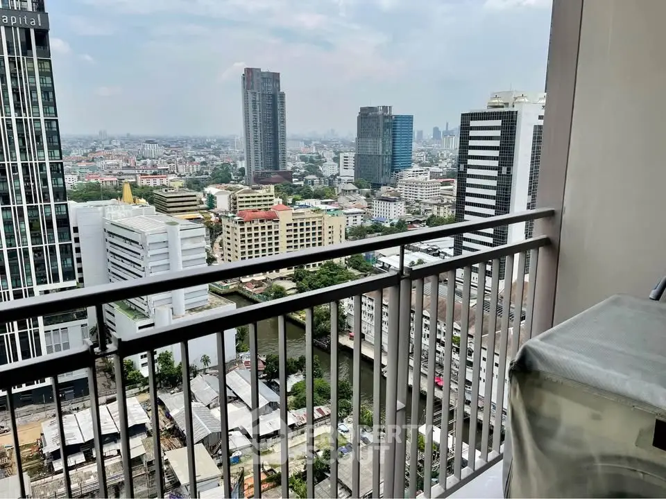 Stunning cityscape view from a high-rise balcony overlooking urban skyline.
