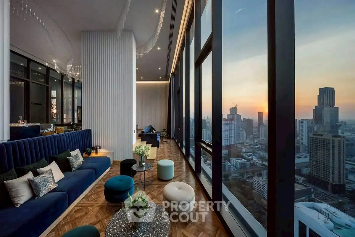 Luxurious high-rise living room with stunning city skyline view at sunset.