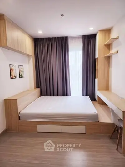 Modern bedroom with built-in wooden furniture and natural light