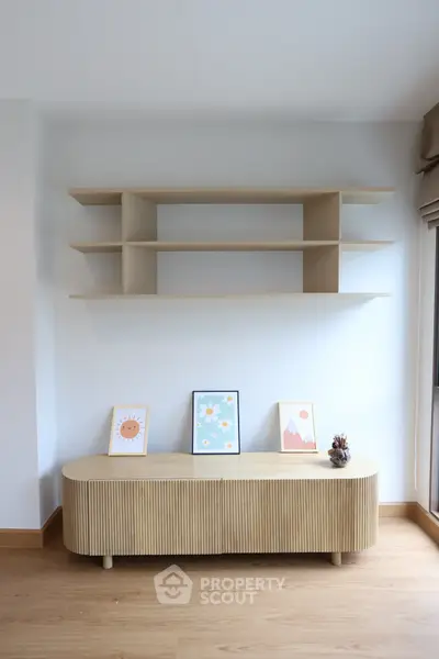Modern minimalist living room with stylish wooden shelves and decor