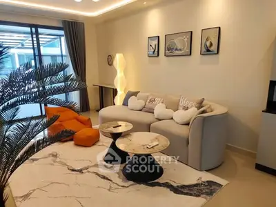 Modern living room with stylish decor, cozy sofa, and elegant lighting in a contemporary apartment.