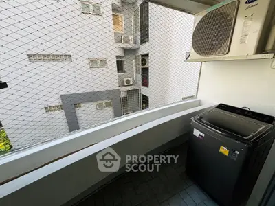 Compact balcony with washing machine and air conditioning unit