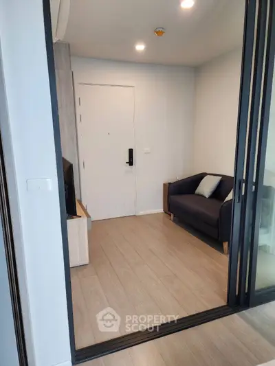 Modern small living room with sleek design and cozy sofa