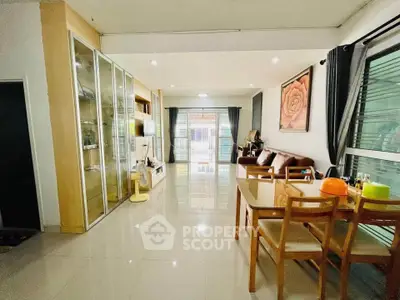 Spacious living room with modern decor and large windows for natural light