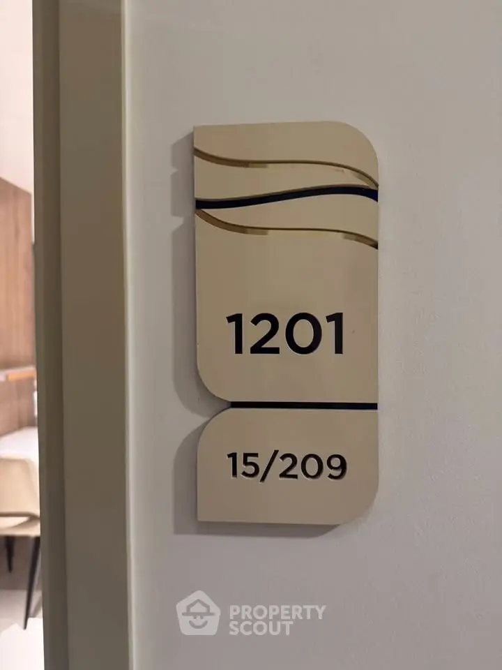 Modern apartment door number 1201 with stylish design in upscale building.