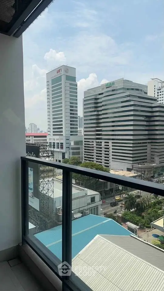 Stunning city view from a modern balcony in a high-rise building, perfect for urban living.