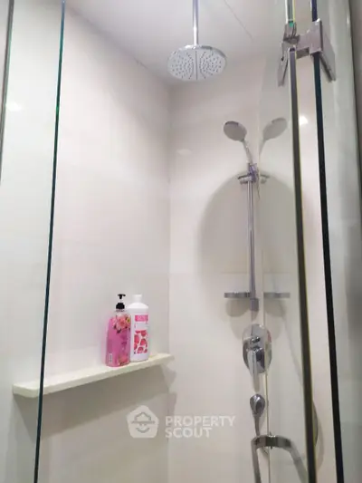 Modern bathroom shower with sleek fixtures and glass enclosure