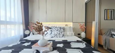 Modern bedroom with stylish decor and natural light