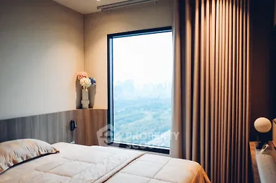 Cozy bedroom with city view and elegant decor