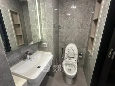Modern bathroom with sleek design and elegant fixtures in a contemporary home.