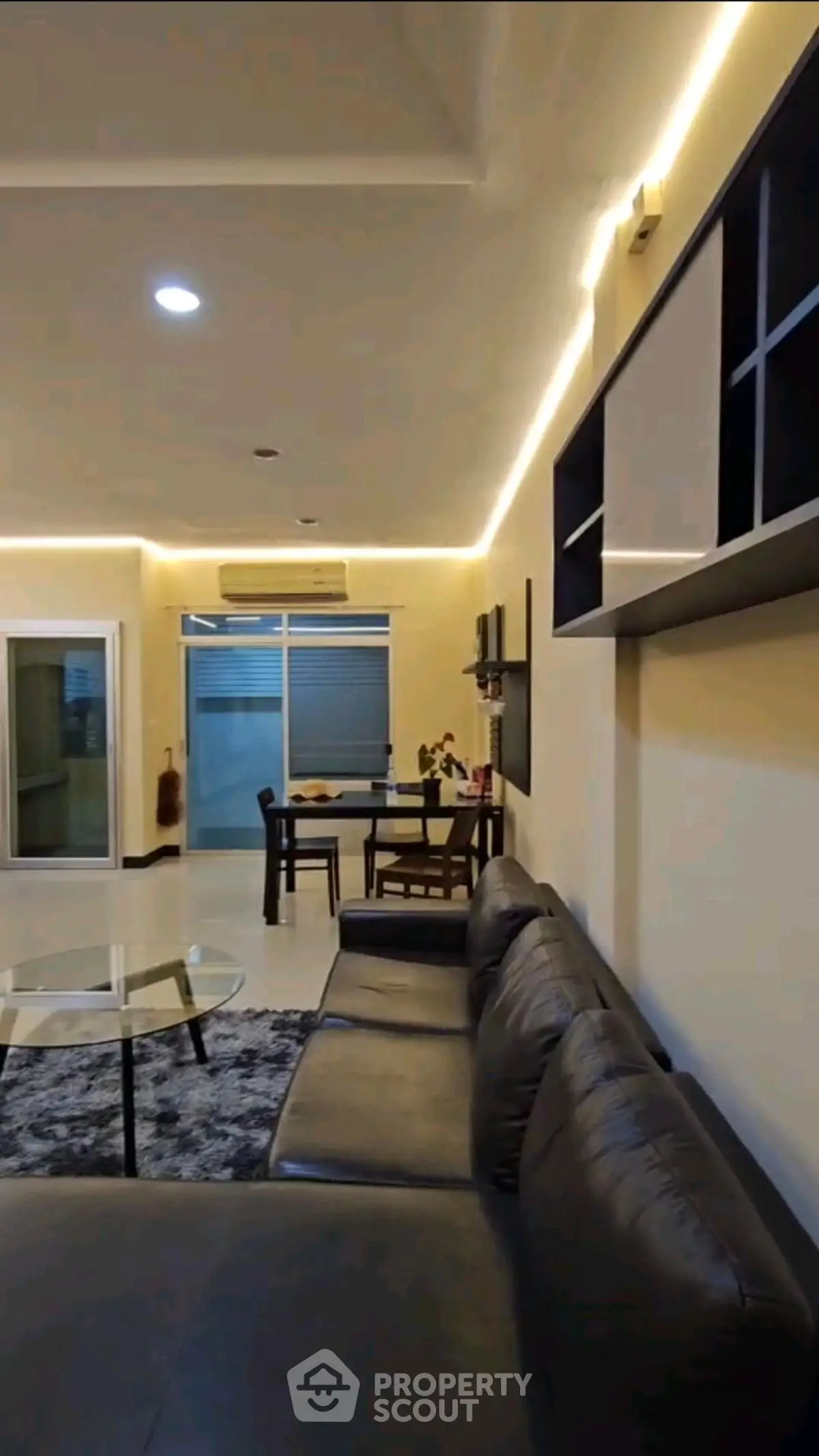 Modern living room with sleek furniture and ambient lighting