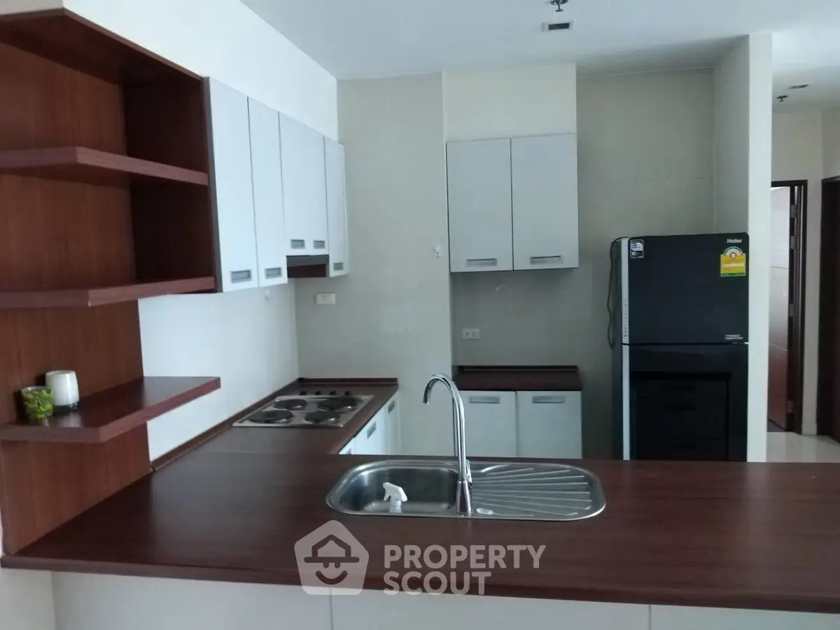 Modern kitchen with sleek wooden countertops and stainless steel sink