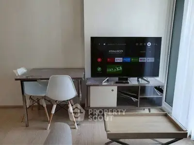 Modern living room with sleek TV setup and minimalist furniture