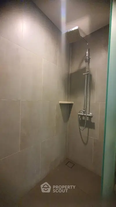 Modern bathroom shower with sleek tile design and rainfall showerhead