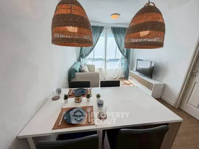 Charming living room with dining area, cozy sofa, and stylish decor in a bright, airy space.