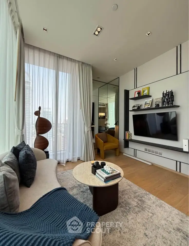 Luxurious modern living room with floor-to-ceiling windows and stylish decor in a high-rise apartment.