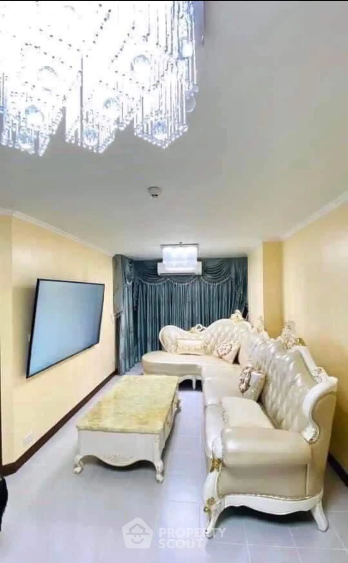 Luxurious living room with elegant furniture and modern chandelier