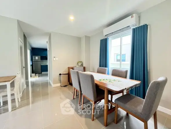 Modern dining area with sleek furniture and natural light