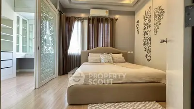 Elegant bedroom with modern decor and built-in storage in a stylish apartment