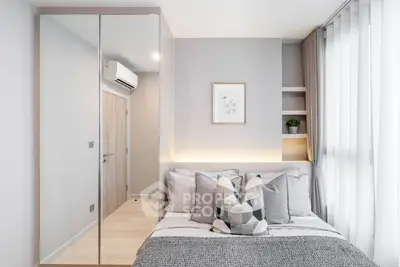 Modern bedroom with stylish decor and natural light