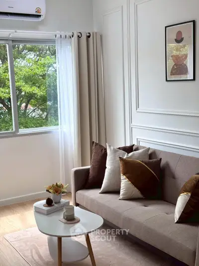 Stylish living room with modern decor and large window view