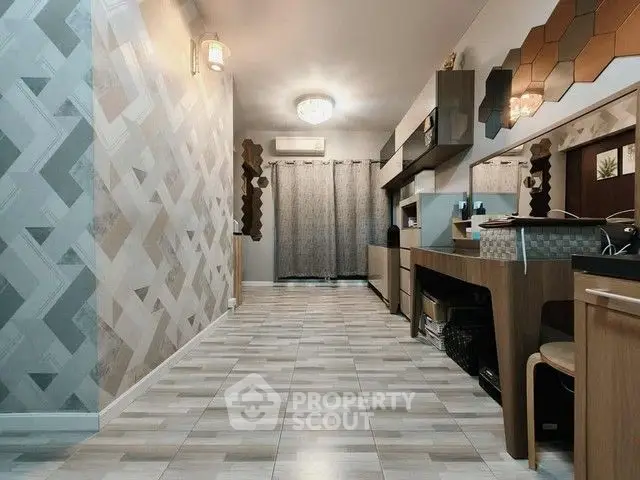 Stylish modern living room with geometric wall design and elegant lighting