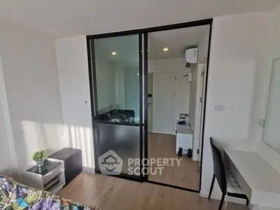 Modern apartment interior with sliding glass doors and stylish decor