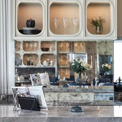 Luxurious kitchen with elegant marble countertops and stylish open shelving.