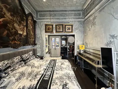 Luxurious bedroom with elegant decor and artistic wall designs