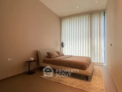 Modern minimalist bedroom with floor-to-ceiling windows and elegant decor