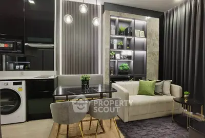 Modern living room with stylish decor, open kitchen, and cozy seating area.