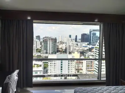 Stunning cityscape view from a modern high-rise apartment window, showcasing urban living at its finest.