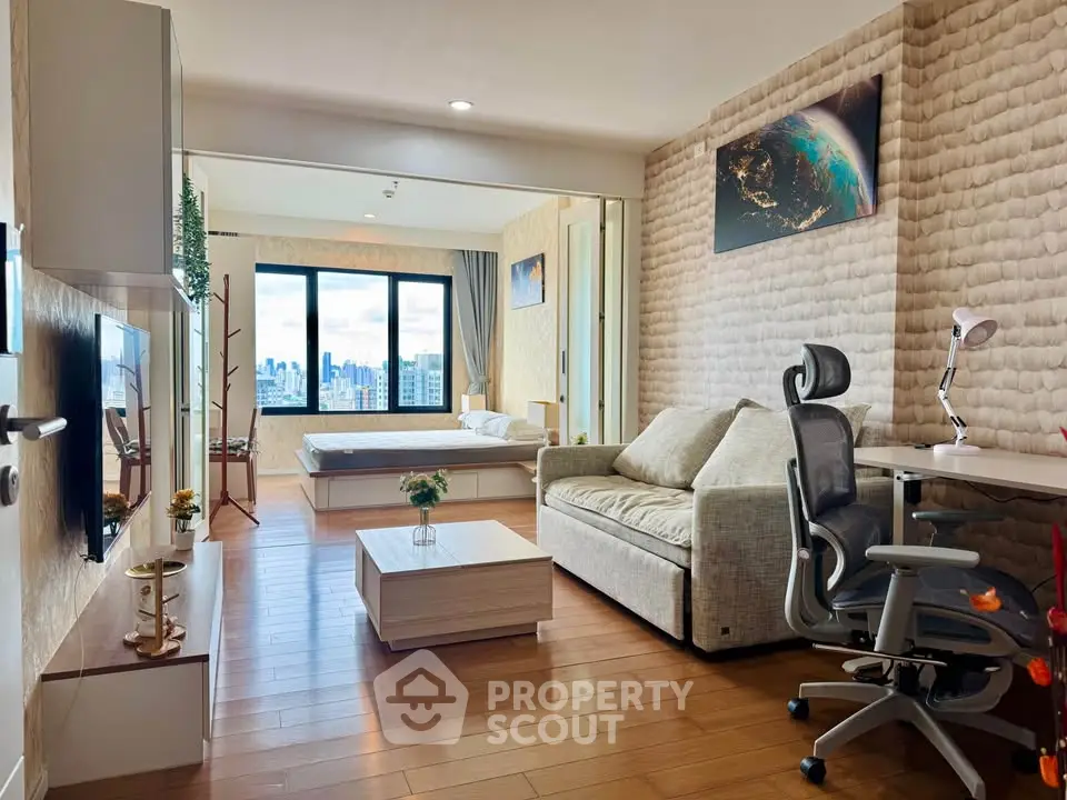 Modern studio apartment with city view, featuring cozy living area and stylish decor.