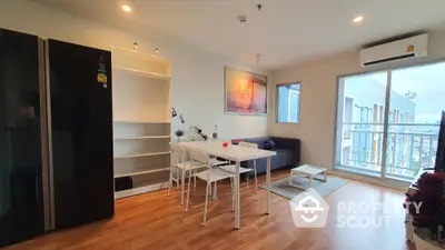 Modern living room with dining area and balcony view in stylish apartment