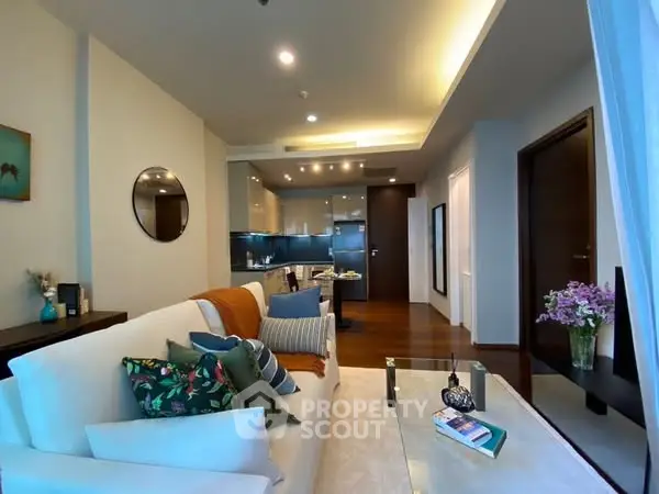 Modern living room with stylish decor and open kitchen layout