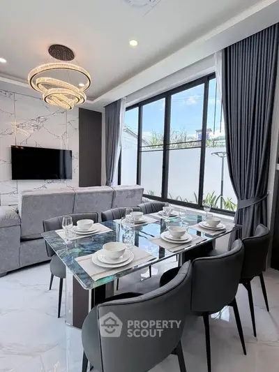 Luxurious modern living room with elegant dining area and large windows