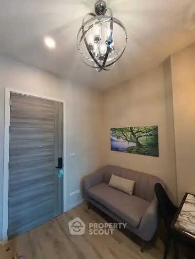 Cozy living room with modern chandelier and stylish decor