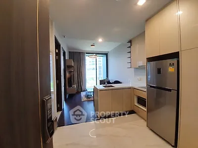 Modern kitchen with sleek appliances and open layout in a stylish apartment