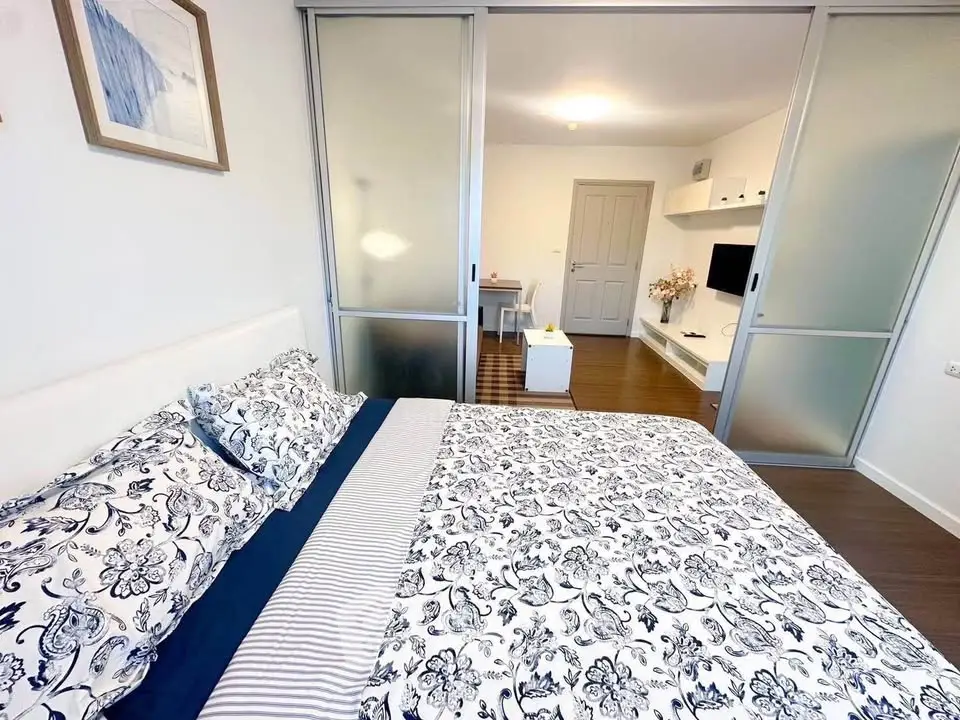 Modern bedroom with sliding glass doors and stylish decor