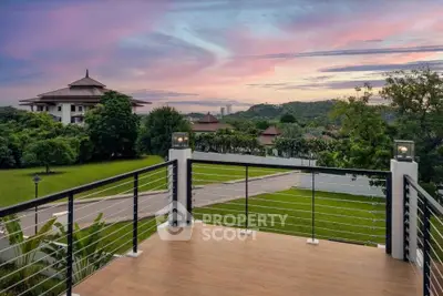 Stunning balcony view with lush greenery and scenic sunset